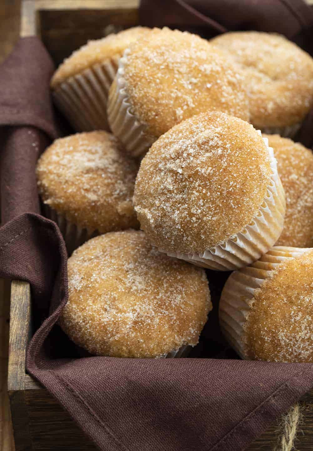 Apple Cider Muffins are full of apple flavor with apple pie spice and apple cider and are the perfect treat to have with a cup of coffee, as a dessert, or even to just satisfy your sweet tooth! apple cider muffins, apple cider, apple pie spice, apple desserts, baking, apple muffins recipe, iambaker, i am baker Apple Cider Muffins in Basket
