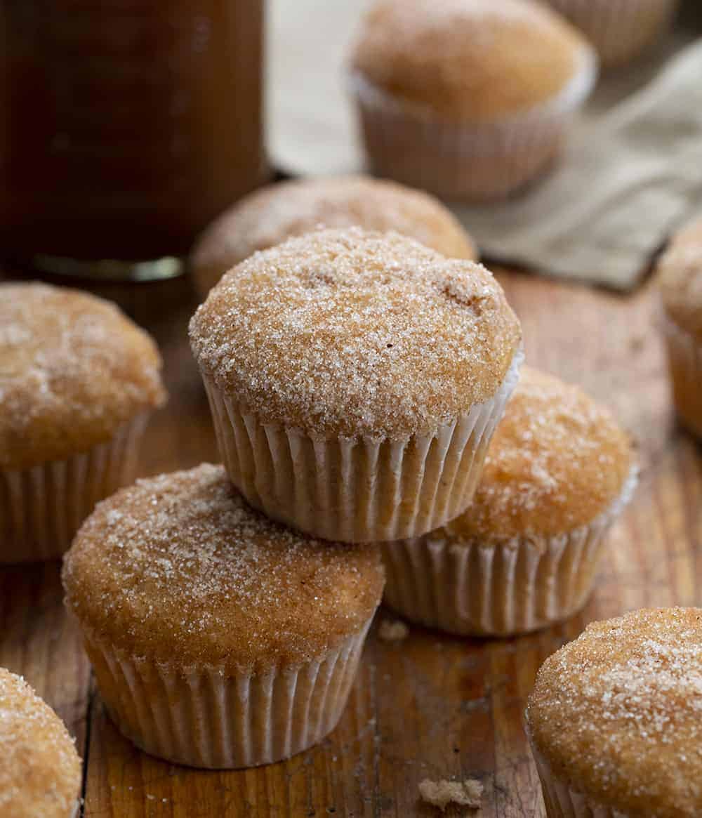 Apple Cider Muffins are full of apple flavor with apple pie spice and apple cider and are the perfect treat to have with a cup of coffee, as a dessert, or even to just satisfy your sweet tooth! apple cider muffins, apple cider, apple pie spice, apple desserts, baking, apple muffins recipe, iambaker, i am baker Apple Cider Muffins on Cutting Board