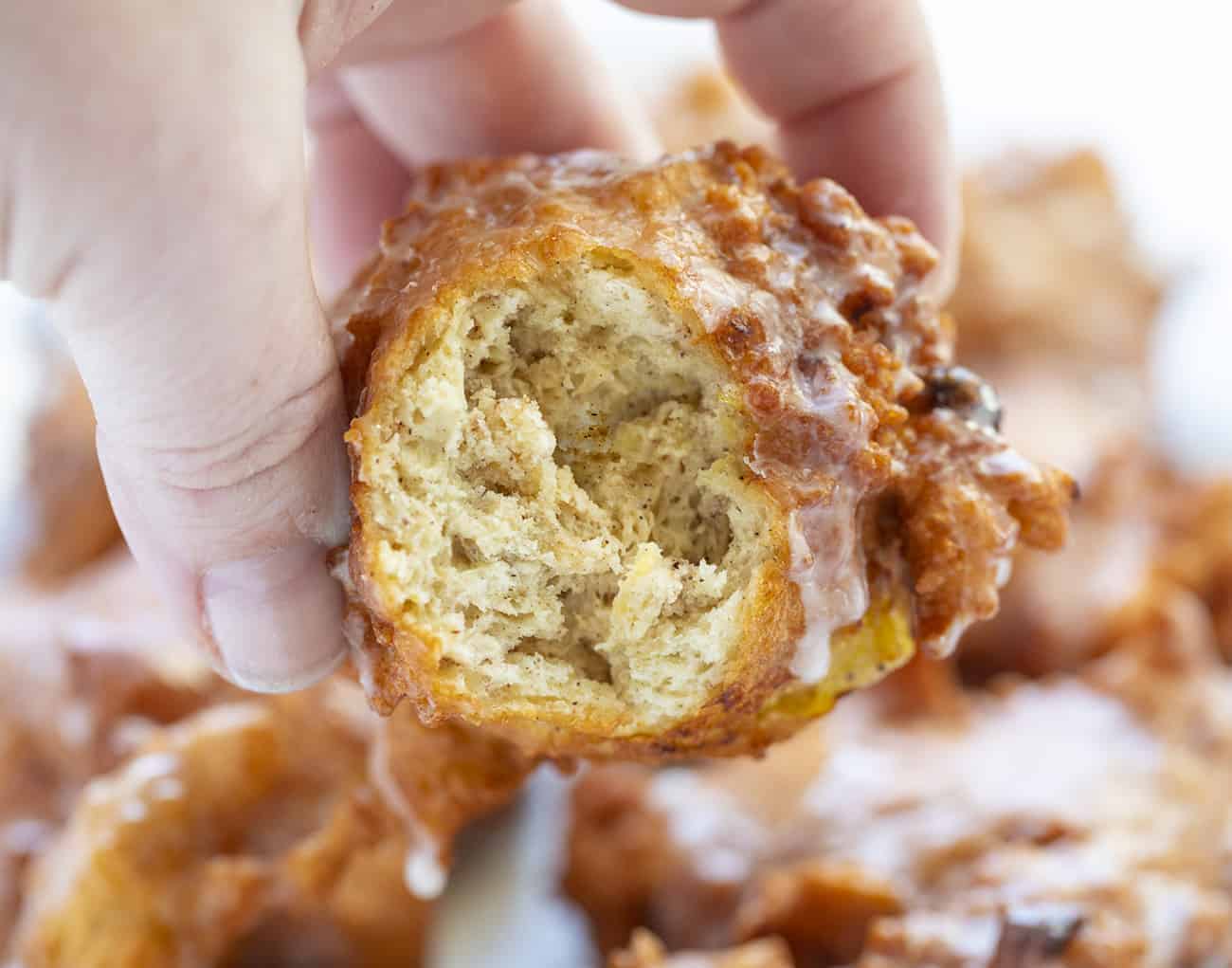 Banana Fritters are made with cakey batter, fried to perfection and loaded with bananas, all topped off with a sweet glaze. banana fritters, homemade fritters, fritters recipes, i am baker, iambaker, homemade glaze Inside of Banana Fritter
