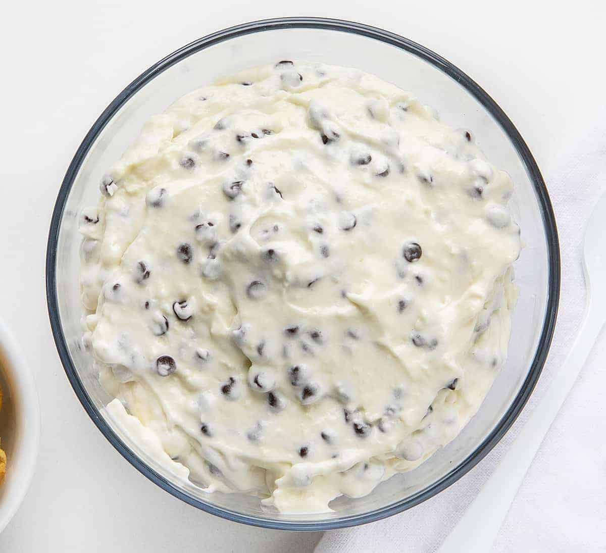This cream cheese, no-bake Chocolate Chip Dip is a creamy and sweet dip that is as easy to whip together as it is to eat with your favorite sweet crackers or fruit! I saw it on TikTok and it was referred to as "Booty Dip". TikTok Booty Dip, Booty Dip, Dessert Dip, Easy Dip, Sweet Dip Recipes, Dessert, Cream Cheese Dip, Marshmallow Fluff Dip, Chocolate Chip Dip, i am baker, iambaker, recipes, tiktok Overhead View of Chocolate Chip Dip - TikTok Booty Dip Recipe