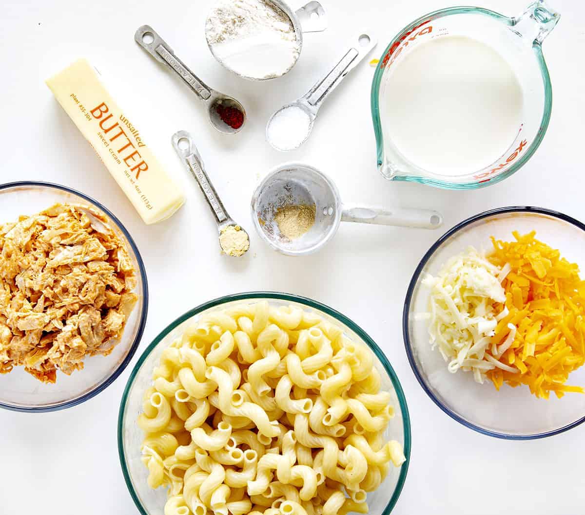 Buffalo Chicken Macaroni and Cheese is a macaroni and cheese that even adults will crave! It's buffalo chicken and cheesy noodles make for a satisfying and addicting dish! homemade macaroni and cheese, buffalo chicken macaroni and cheese, homemade buffalo sauce, home made ranch dressing, rotisserie chicken, iambaker, dinner recipes Ingredients for Buffalo Macaroni and Cheese