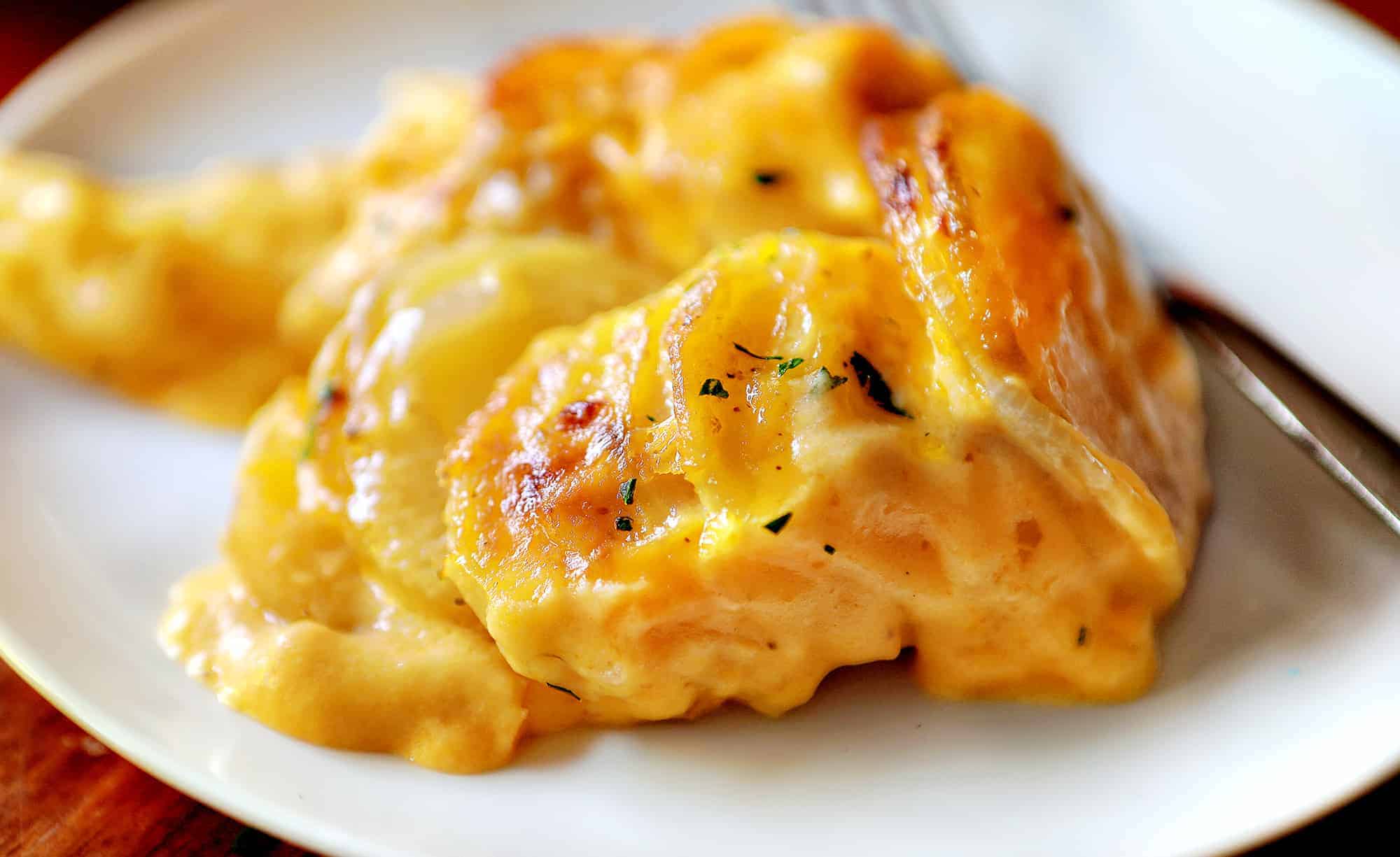 These tried and true top ten recipes from January 2021 have you covered from main dishes, to sweet treats, to desserts! i am baker, iambaker, scalloped potatoes, cheesy scalloped potatoes, cheesy potatoes, potatoes, side dishes Cheesy Scalloped Potatoes on Plate