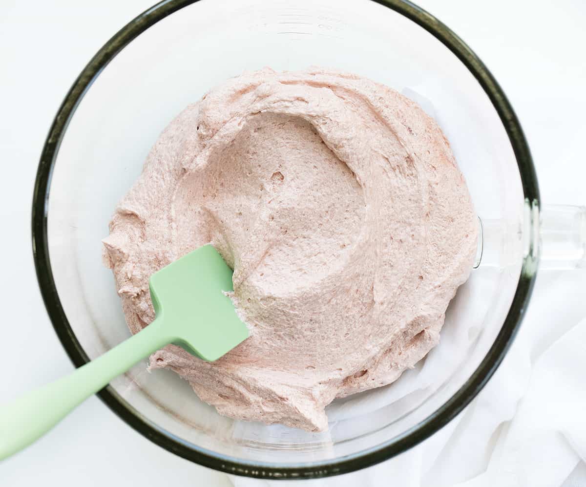 Strawberry Ermine Frosting (or a version of $300 frosting) is a luscious frosting made with a cooked flour and milk mixture added to butter, sugar, and freeze-dried strawberry powder. Also known as milk frosting, flour buttercream, or flour frosting, it has a silky smooth texture with the taste of real strawberries in every bite. Strawberry Ermine Frosting in the Mixer Bowl.