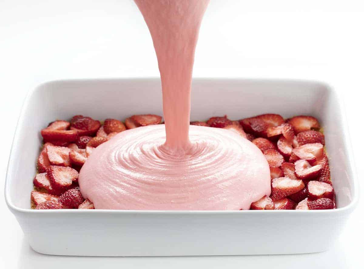 Strawberry Icebox Cheesecake is a light and fluffy no-bake dessert with fresh strawberries and a graham cracker crust. Strawberry Jello Cake, Woolworth Cake, Icebox Cake, Strawberry Woolworth Icebox Cake, Summer Cake, Refrigerator Cake, No Bake, Dessert, Strawberry Dessert, recipes, i am baker, iambaker Adding Filling to Strawberry Icebox Cheesecake